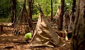 Child behing Wild Pines tent