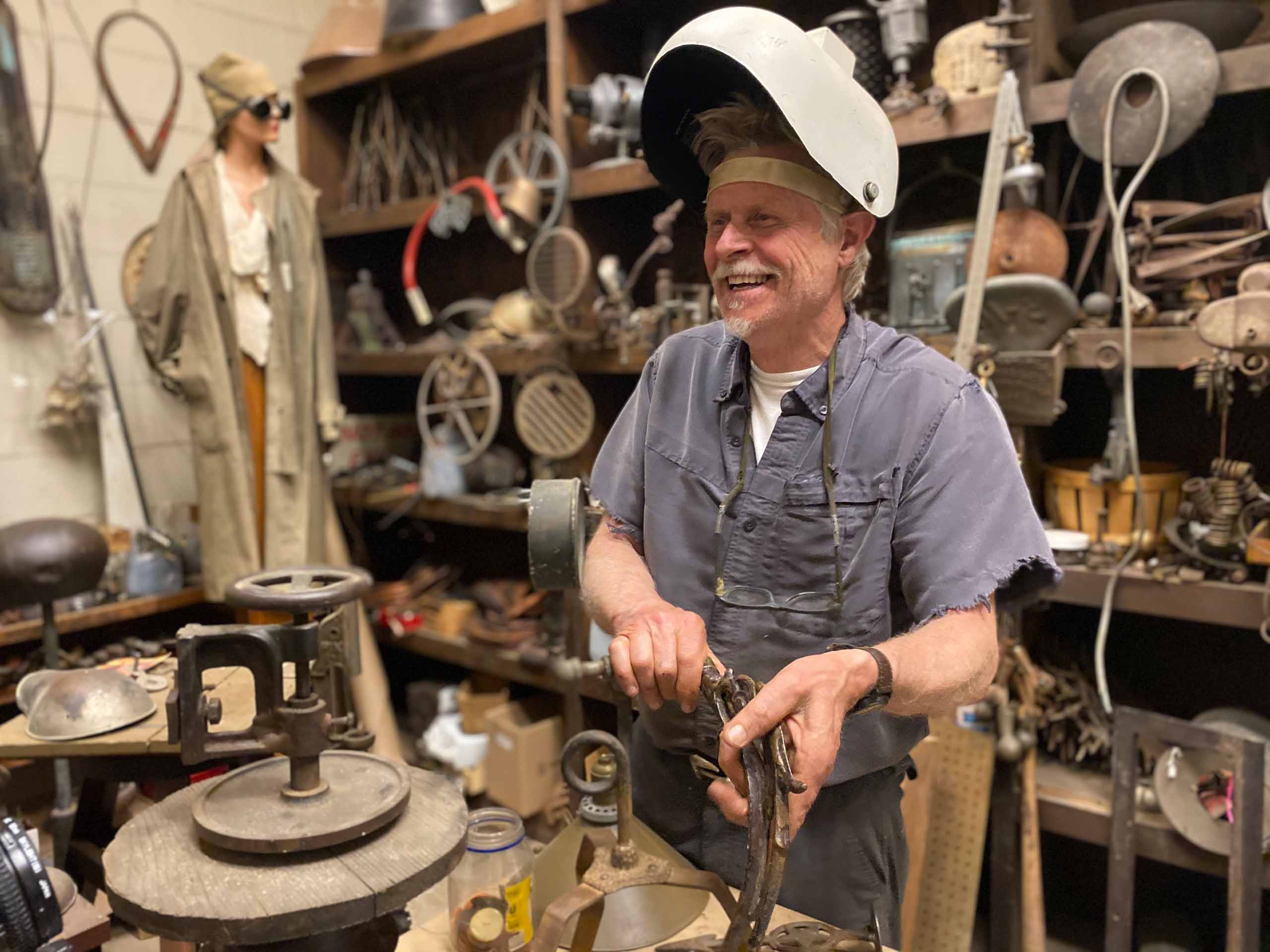 Barney Bellinger smiling in his workshop