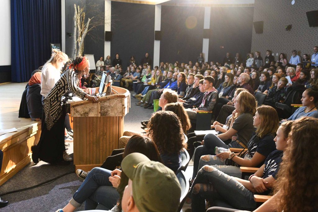 Speaker at lectern of Adirondack Youth Climate Summit