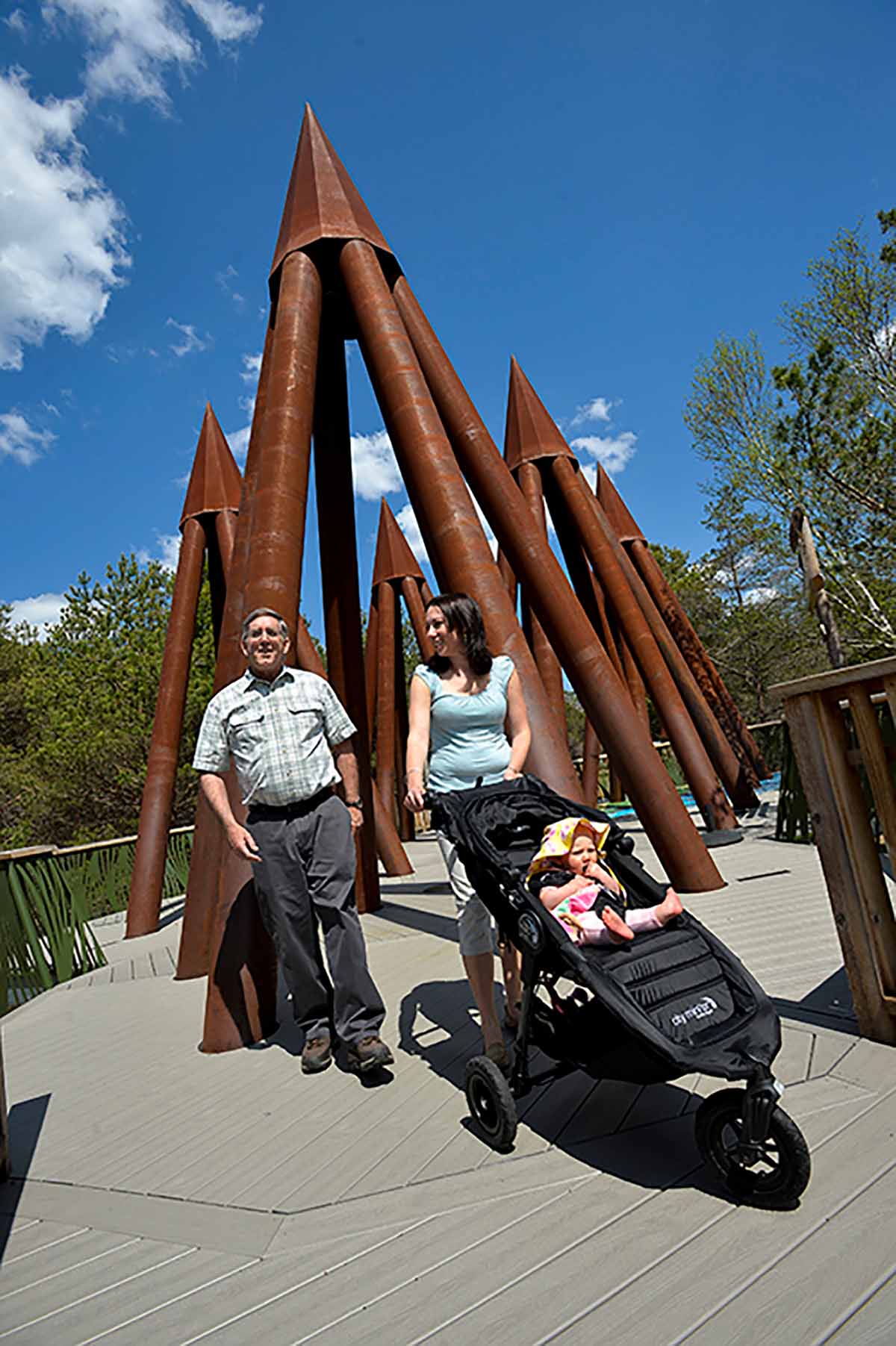 Man and woman pushing stroller on Wild Walk