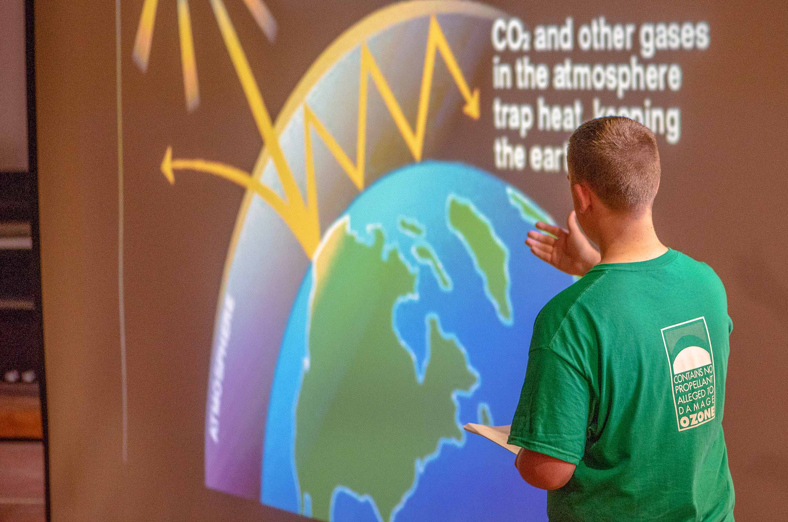 Teenager giving PowerPoint presentation on climate change