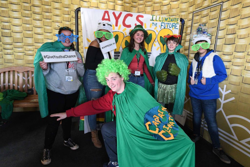 Group of Adirondack Youth Climate Attendees posing with goofy items