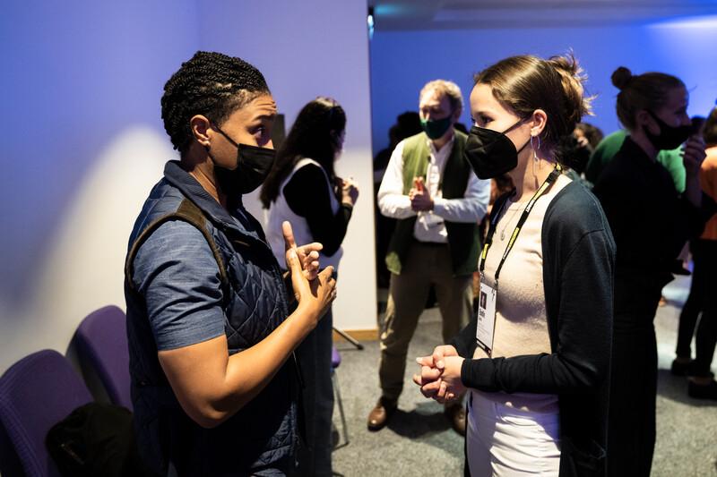 Two attendees in discussion