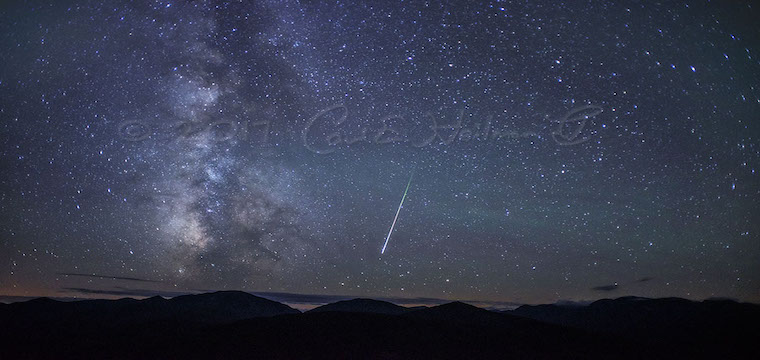 Nightime view over the mountains with visible stars